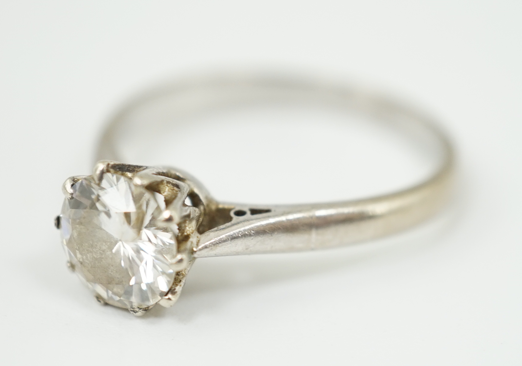 A white gold and solitaire diamond set ring